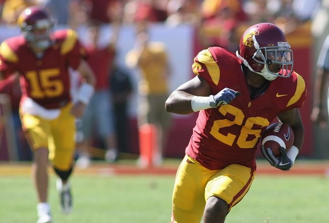LOS ANGELES, CA - SEPTEMBER 5:  Running back Marc Tyler #26 of the USC Trojans carries the ball against the San Jose State Spartans on September 5, 2009 at the Los Angeles Memorial Coliseum in Los Angeles, California.  USC won 56-3.  (Photo by Jeff Golden/Getty Images)