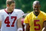 ASHBURN, VA - AUGUST 06:  Quarterback Donovan McNabb #5 of the Washington Redskins and tight end Chris Cooley #47 walk off the field following practice during Redskins training camp on August 6, 2010 in Ashburn, Virginia.  (Photo by Win McNamee/Getty Images)