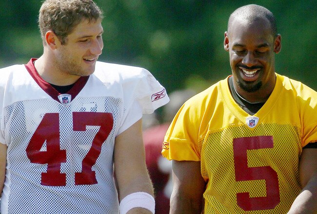 ASHBURN, VA - AUGUST 06:  Quarterback Donovan McNabb #5 of the Washington Redskins and tight end Chris Cooley #47 walk off the field following practice during Redskins training camp on August 6, 2010 in Ashburn, Virginia.  (Photo by Win McNamee/Getty Images)