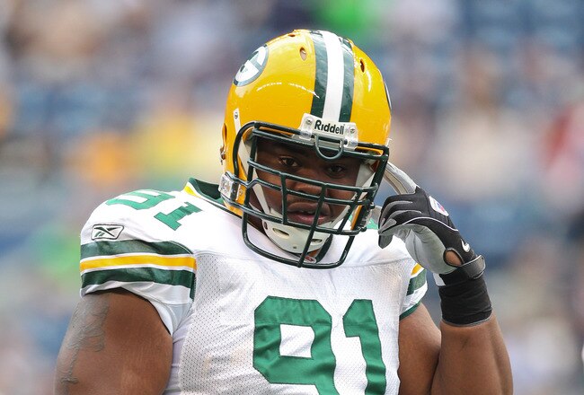 SEATTLE - AUGUST 21:  Defensive end Justin Harrell #91 of the Green Bay Packers looks on during warmups prior to the preseason game against the Seattle Seahawks at Qwest Field on August 21, 2010 in Seattle, Washington. (Photo by Otto Greule Jr/Getty Images)