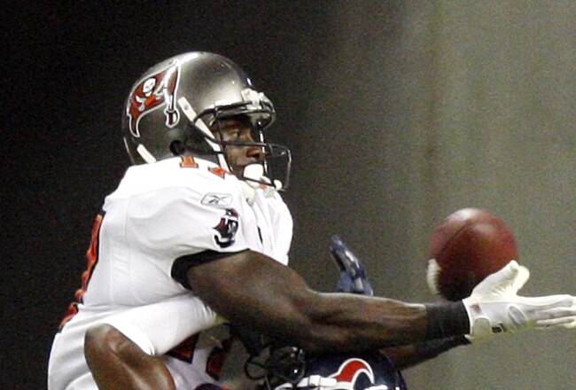 HOUSTON - SEPTEMBER 02:  Wide receiver Arrelious Benn #17 of the Tampa Bay Buccaneers leaps over cornerback Jacques Reeves #35 of the Houston Texans for a touchdown in the fourth quarter at Reliant Stadium on September 2, 2010 in Houston, Texas.  (Photo by Bob Levey/Getty Images)