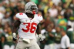 PASADENA, CA - JANUARY 01:  Linebacker Brian Rolle #36 of the Ohio State Buckeyes reacts to a play against the Oregon Ducks in the 96th Rose Bowl game on January 1, 2010 in Pasadena, California.  (Photo by Stephen Dunn/Getty Images)