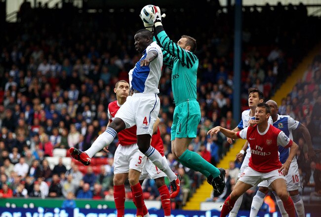 BLACKBURN, ENGLAND - AUGUST 28:  Manuel Almunia of Arsenal claims the ball under pressure from Chris Samba of Blackburn Rovers during the Barclays Premier League match between Blackburn Rovers and Arsenal at Ewood Park on August 28, 2010 in Blackburn, England.  (Photo by Clive Brunskill/Getty Images)