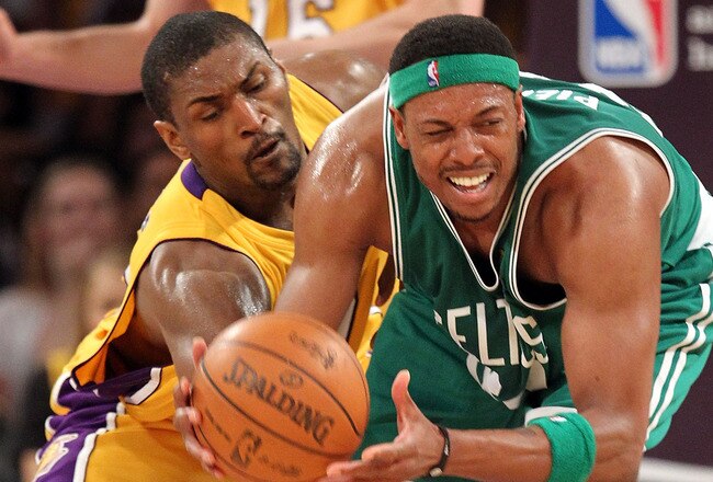 LOS ANGELES, CA - JUNE 17:  Paul Pierce #34 of the Boston Celtics looks to move the ball as he is covered by Ron Artest #37 of the Los Angeles Lakers in the first quarter of Game Seven of the 2010 NBA Finals at Staples Center on June 17, 2010 in Los Angeles, California.  NOTE TO USER: User expressly acknowledges and agrees that, by downloading and/or using this Photograph, user is consenting to the terms and conditions of the Getty Images License Agreement.  (Photo by Ronald Martinez/Getty Images)