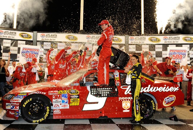 HAMPTON, GA - SEPTEMBER 06:  Kasey Kahne, driver of the #9 Budweiser Dodge celebrates in victory lane after winning the NASCAR Sprint Cup Series Pep Boys Auto 500 at Atlanta Motor Speedway on September 6, 2009 in Hampton, Georgia.  (Photo by John Harrelson/Getty Images)
