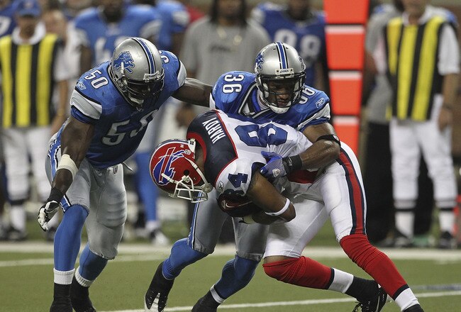 DETROIT - SEPTEMBER 02: Isaiah Ekejiuba #50 and Paul Pratt #36 of the Detroit Lions makes the stop on James Hardy #84 of the Buffalo Bills during the fouth quarter of the preseason game at Ford Field on September 2, 2010 in Detroit, Michigan. The Lions defeated the Bills 28-23.  (Photo by Leon Halip/Getty Images)