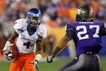 GLENDALE, AZ - JANUARY 04:  Titus Young #4 of the Boise State Broncos runs after a catch against Jason Teague #27 of the TCU Horned Frogs during the Tostitos Fiesta Bowl at the Universtity of Phoenix Stadium on January 4, 2010 in Glendale, Arizona.  (Photo by Christian Petersen/Getty Images)