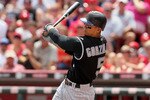 CINCINNATI - JULY 18: Carlos Gonzalez #5 of the Colorado Rockies is at bat during the game against the Cincinnati Reds at Great American Ball Park on July 18, 2010 in Cincinnati, Ohio.  (Photo by Andy Lyons/Getty Images)