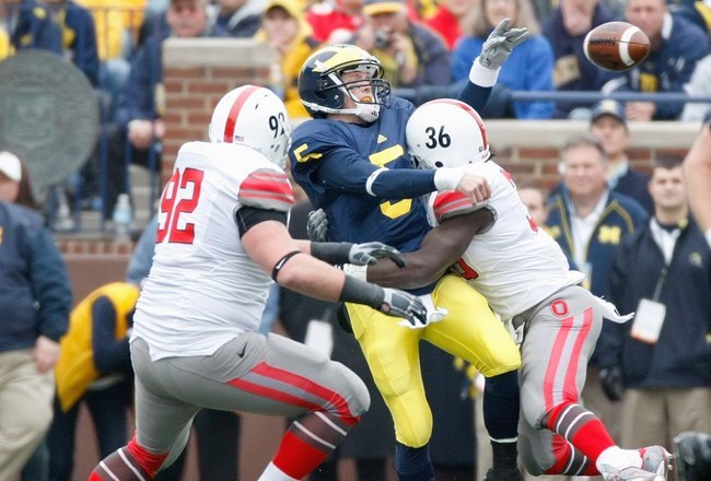 ANN ARBOR, MI - NOVEMBER 21:  Quarterback Tate Forcier #5 of the Michigan Wolverines is sacked by Brian Rolle #36 the Ohio State Buckeyes on November 21, 2009 at Michigan Stadium in Ann Arbor, Michigan. Ohio State won the game 21-10. (Photo by Gregory Shamus/Getty Images)