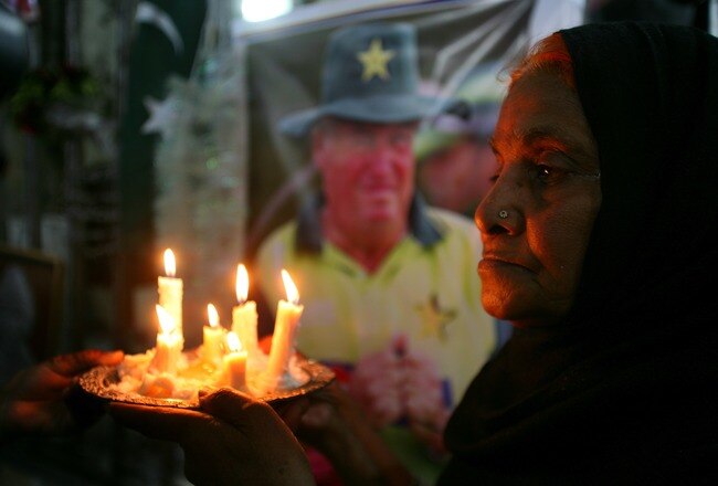 ISLAMABAD, PAKISTAN - APRIL 02:  Mourners hold a candle light vigil for slain cricket coach Bob Woolmer April 2, 2007 in Islamabad, Pakistan. A small memorial service was held for Woolmer, who was strangled March 18 in Jamaica, following the Pakistani team's early exit from the Cricket World Cup against Ireland.  (Photo by John Moore/Getty Images)