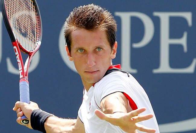 NEW YORK - SEPTEMBER 01:  Sergiy Stakhovsky of the Ukraine returns a shot against Peter Luczak of Australia during his first round men's match on day three of the 2010 U.S. Open at the USTA Billie Jean King National Tennis Center on September 1, 2010 in the Flushing neighborhood of the Queens borough of New York City.  (Photo by Matthew Stockman/Getty Images)