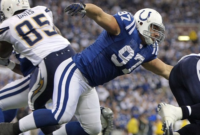 INDIANAPOLIS - JANUARY 13:  Quinn Pitcock #97 of the Indianapolis Colts chases down running back Michael Turner #33 of the San Diego Chargers during their AFC Divisional Playoff game at the RCA Dome on January 13, 2008 in Indianapolis, Indiana. The Chargers won 28-24. (Photo by Doug Pensinger/Getty Images)