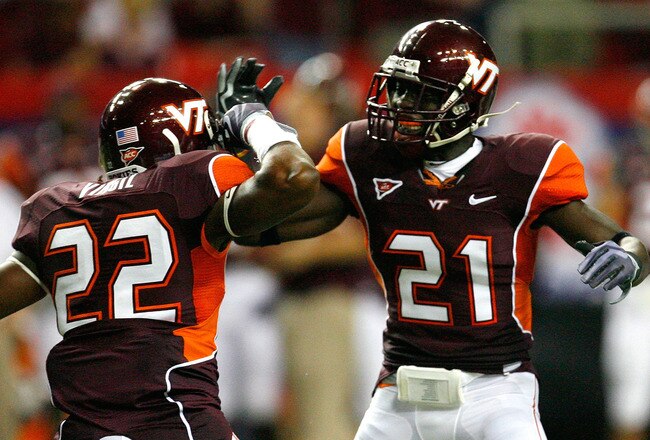 ATLANTA - SEPTEMBER 05:  Stephan Virgil #22 and Rashad Carmichael #21 of the Virginia Tech Hokies celebrate a defensive stop against the Alabama Crimson Tide during the Chick-fil-A Kickoff Game at Georgia Dome on September 5, 2009 in Atlanta, Georgia.  (Photo by Kevin C. Cox/Getty Images)