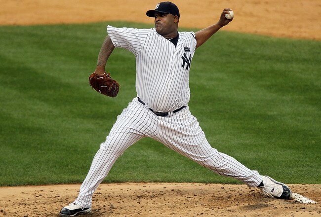 NEW YORK - AUGUST 22:  CC Sabathia #52 of the New York Yankees delivers a pitch against the Seattle Mariners on August 22, 2010 at Yankee Stadium in the Bronx borough of New York City.  (Photo by Jim McIsaac/Getty Images)
