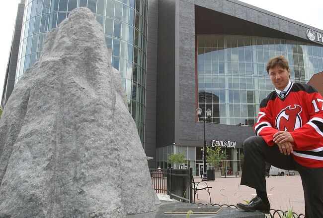NEWARK, NJ - JULY 20:  Ilya Kovalchuk of the New Jersey Devils poses for photographs following the media opportunity announcing his contract renewal at the Prudential Center on July 20, 2010 in Newark, New Jersey.  (Photo by Bruce Bennett/Getty Images)