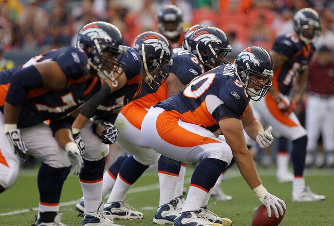 DENVER - AUGUST 29:  Center J.D. Walton #50 of the Denver Broncos leads the offensive line as he  prepares snap the ball against the Pittsburgh Steelers during preseason NFL action at INVESCO Field at Mile High on August 29, 2010 in Denver, Colorado. The Broncos defeated the Steelers 34-17.  (Photo by Doug Pensinger/Getty Images)