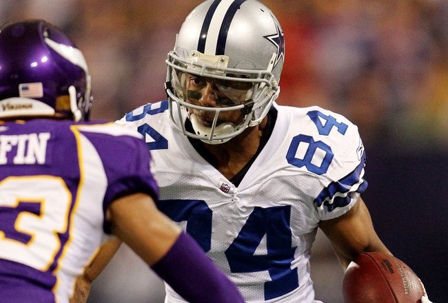 MINNEAPOLIS - JANUARY 17:  Wide receiver Patrick Crayton #84 of the Dallas Cowboys runs the ball against Cedric Griffin #23 of the Minnesota Vikings during the NFC Divisional Playoff Game at Hubert H. Humphrey Metrodome on January 17, 2010 in Minneapolis, Minnesota. The Vikings defeated the Cowboys 34-3.  (Photo by Chris McGrath/Getty Images)