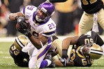 NEW ORLEANS - JANUARY 24:  Chester Taylor #29 of the Minnesota Vikings gets tackled by Marvin Mitchell #50 and Bobby McCray #93 of the New Orleans Saints as Roman Harper #41 look on during the NFC Championship Game at the Louisiana Superdome on January 24, 2010 in New Orleans, Louisiana.  (Photo by Ronald Martinez/Getty Images)