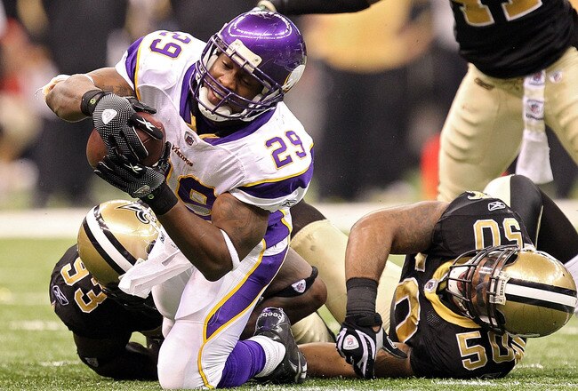 NEW ORLEANS - JANUARY 24:  Chester Taylor #29 of the Minnesota Vikings gets tackled by Marvin Mitchell #50 and Bobby McCray #93 of the New Orleans Saints as Roman Harper #41 look on during the NFC Championship Game at the Louisiana Superdome on January 24, 2010 in New Orleans, Louisiana.  (Photo by Ronald Martinez/Getty Images)