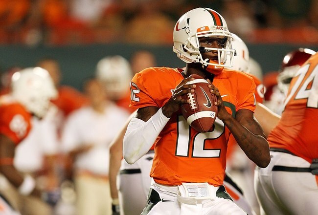 MIAMI GARDENS, FL - OCTOBER 03:  Quarterback Jacory Harris #12 of the Miami Hurricanes drops back to pass against the Oklahoma Sooners at Land Shark Stadium on October 3, 2009 in Miami Gardens, Florida. Miami defeated Oklahoma 21-20.  (Photo by Doug Benc/Getty Images)
