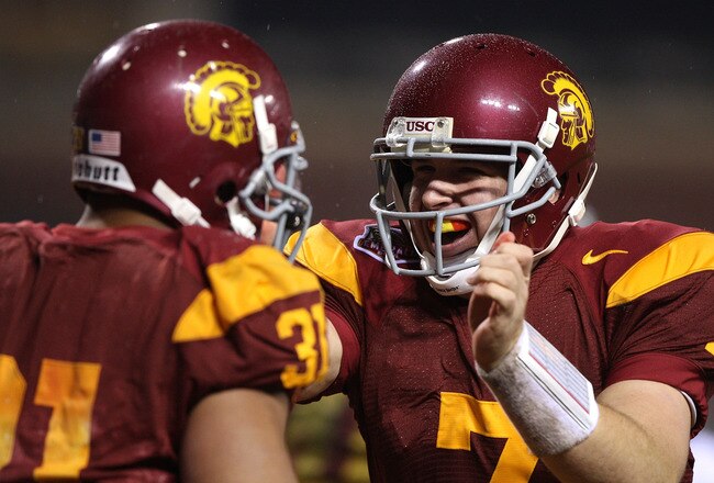 SAN FRANCISCO - DECEMBER 26: Matt Barkley #7 of the USC Trojans celebrates with Stanley Havili #31 after scoring a touchdown in the second quarter against the Boston College Eagles during the 2009 Emerald Bowl at AT&T Park on December 26, 2009 in San Francisco, California. (Photo by Jed Jacobsohn/Getty Images)