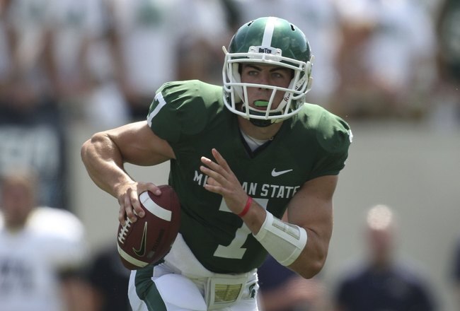EAST LANSING, MI - SEPTEMBER 05:  Keith Nichol #7 of the Michigan State Spartans roles out to pass against the Montana State Bobcats during the second quarter on September 5, 2009 at Spartan Stadium in East Lansing, Michigan.  (Photo by Leon Halip/Getty Images)