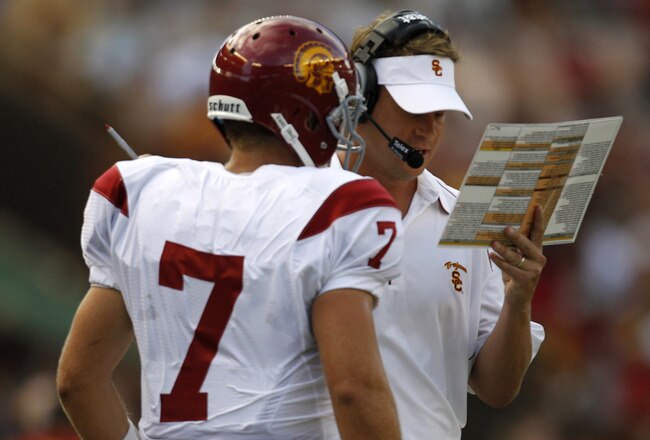 HONOLULU - SEPTEMBER 2:  Head Coach Lane Kiffin of the University of South Carolina Trojans talks to Quarterback Matt Barkley #7 during first half action against the University of Hawaii Warriors at Aloha Stadium September 2, 2010 in Honolulu, Hawaii. (Photo by Kent Nishimura/Getty Images)