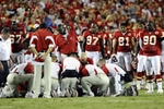 KANSAS CITY, MO - AUGUST 27: Players for the Kansas City Chiefs look on as physicians tend to Cameron Sheffield #55 who suffered an injury during a preseason game against the Philadelphia Eagles at Arrowhead Stadium on August 27, 2010 in Kansas City, Missouri.  (Photo by G. Newman Lowrance/Getty Images)