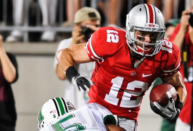 COLUMBUS, OH - SEPTEMBER 2: Dane Sanzenbacher #12 of the Ohio State Buckeyes runs with the ball against the Marshall Thundering Herd at Ohio Stadium on September 2, 2010 in Columbus, Ohio. (Photo by Jamie Sabau/Getty Images)