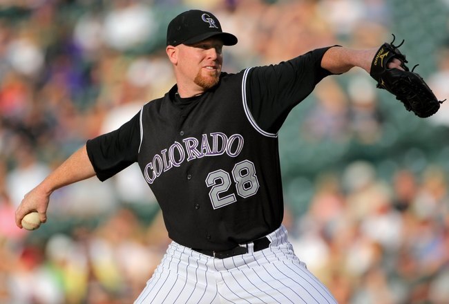 DENVER - JULY 09:  Starting pitcher Aaron Cook #28 the Colorado Rockies delivers against the Atlanta Braves during MLB action at Coors Field on July 9, 2009 in Denver, Colorado. The Rockies defeated the Braves 7-6.  (Photo by Doug Pensinger/Getty Images)