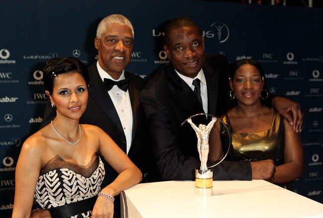 ABU DHABI, UNITED ARAB EMIRATES - MARCH 10:  (Left to Right) Dorys Erving the wife of former basketball player Julius Erving  with US basketball legend Dikembe Mutombo and his wife Rose Mutumbo arrive at the Laureus World Sports Awards 2010 at Emirates Palace Hotel on March 10, 2010 in Abu Dhabi, United Arab Emirates.  (Photo by Ian Walton/Getty Images for Laureus)
