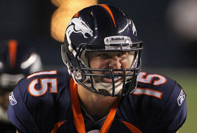 DENVER - AUGUST 29:  Quarterback Tim Tebow #15 of the Denver Broncos lines up over center J.D. Walton #50 and prepares to take the snap against the Pittsburgh Steelers during preseason NFL action at INVESCO Field at Mile High on August 29, 2010 in Denver, Colorado. The Broncos defeated the Steelers 34-17.  (Photo by Doug Pensinger/Getty Images)