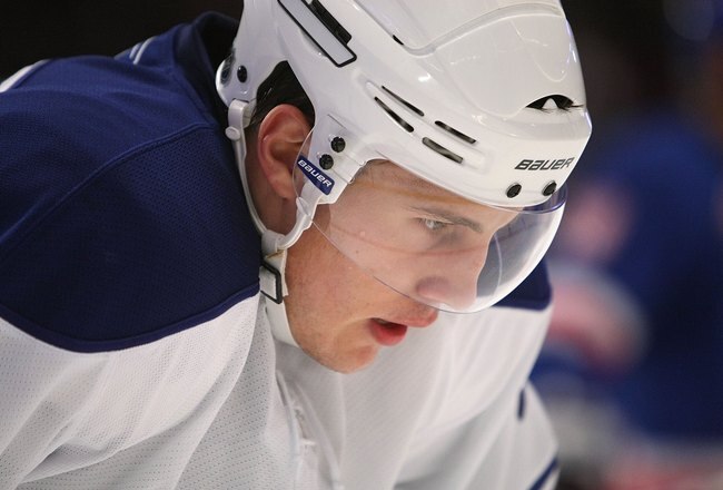 NEW YORK - OCTOBER 12: Luke Schenn #2 of the Toronto Maple Leafs looks on during a break in NHL game action against the New York Rangers at Madison Square Garden on October 12, 2009 in New York City.  (Photo by Nick Laham/Getty Images)