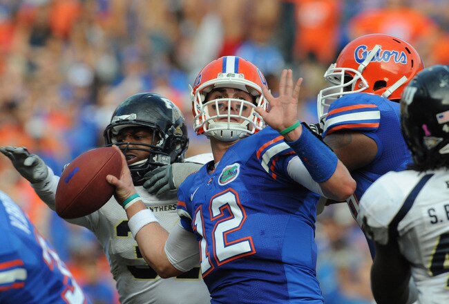 GAINESVILLE, FL - NOVEMBER 21: Quarterback John Brantley #12 of the Florida Gators sets to pass against the Florida International University Golden Panthers, November 21, 2009 at Ben Hill Griffin Stadium in Gainesville, Florida.  (Photo by Al Messerschmidt/Getty Images)