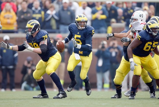 ANN ARBOR, MI - NOVEMBER 21:  Quarterback Tate Forcier #5 of the Michigan Wolverines moves to pass the ball during the game against the Ohio State Buckeyes on November 21, 2009 at Michigan Stadium in Ann Arbor, Michigan. Ohio State won the game 21-10. (Photo by Gregory Shamus/Getty Images)