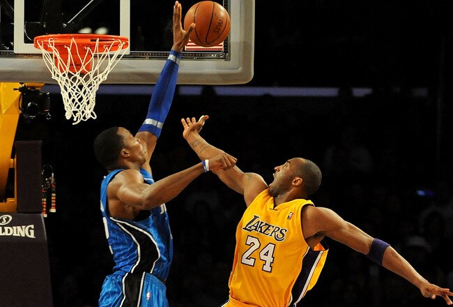 LOS ANGELES, CA - JANUARY 18:  Dwight Howard #12 of the Orlando Magic blocks the shot by Kobe Bryant #24 of the Los Angeles Lakers in the fourth quarter during the game on January 18, 2010 at Staples Center in Los Angeles, California. NOTE TO USER: User expressly acknowledges and agrees that, by downloading and/or using this Photograph, user is consenting to the terms and conditions of the Getty Images License Agreement.  (Photo by Harry How/Getty Images)
