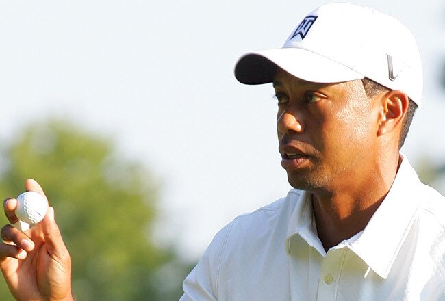 NORTON, MA - SEPTEMBER 04:  Tiger Woods reacts after making a birdie on the fourth hole during the second round of the Deutsche Bank Championship at TPC Boston on September 4, 2010 in Norton, Massachusetts.  (Photo by Michael Cohen/Getty Images)