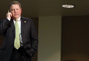 SOUTH BEND, IN - DECEMBER 11: Brian Kelly talks on his phone shortly after being named new football head coach at Notre Dame University on December 11, 2009 in South Bend, Indiana. Kelly most recently led the University of Cincinnati to two consecutive Bowl Championship Series appearances including a perfect 12-0 record this past season. (Photo by Frank Polich/Getty Images)