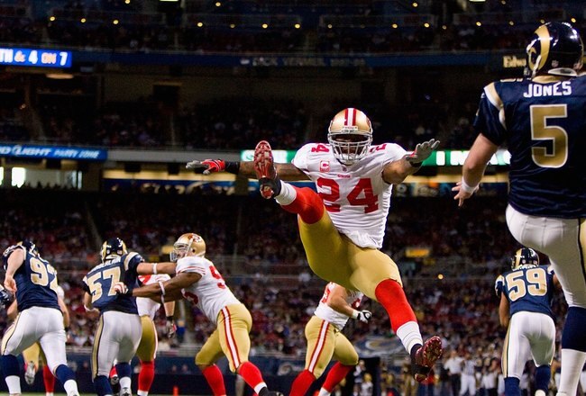 ST. LOUIS - JANUARY 3: Michael Robinson #24 of the San Francisco 49ers leaps to block the punt by Donnie Jones #5 of the St. Louis Rams at the Edward Jones Dome on January 3, 2010 in St. Louis, Missouri.  The 49ers beat the Rams 28-6.  (Photo by Dilip Vishwanat/Getty Images)