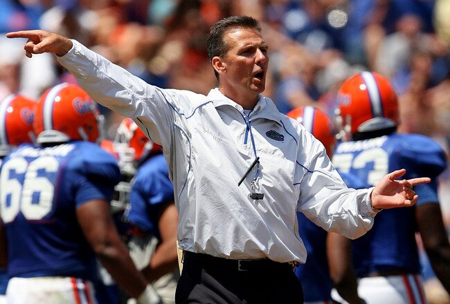 GAINESVILLE, FL - APRIL 10:  Head coach Urban Meyer of the Florida Gators coaches his team during the Orange & Blue game at Ben Hill Griffin Stadium on April 10, 2010 in Gainesville, Florida.  (Photo by Doug Benc/Getty Images)