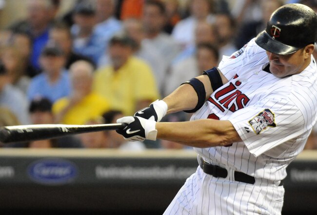 MINNEAPOLIS, MN - JUNE 28:  Jim Thome #25 of the Minnesota Twins hits a solo home run in the sixth inning against the Detroit Tigers during their game on June 28, 2010 at Target Field in Minneapolis, Minnesota. Tigers defeated the Twins 7-5. (Photo by Hannah Foslien/Getty Images)