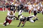 GLENDALE, AZ - SEPTEMBER 02:  Runningback Keiland Williams #35 of the Washington Redskins and Reggie Walker #56 of the Arizona Cardinals dive for a loose ball during preseason NFL game at the University of Phoenix Stadium on September 2, 2010 in Glendale, Arizona.  The Cardinals defeated the Redskins 20-10.   (Photo by Christian Petersen/Getty Images)