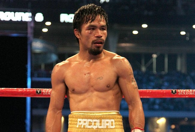 ARLINGTON, TX - MARCH 13:  Manny Pacquiao of the Philippines looks on in the ring against Joshua Clottey of Ghana during the WBO welterweight title fight at Cowboys Stadium on March 13, 2010 in Arlington, Texas. Pacquiao defeated Clottey by unanimous decision.  (Photo by Jed Jacobsohn/Getty Images)