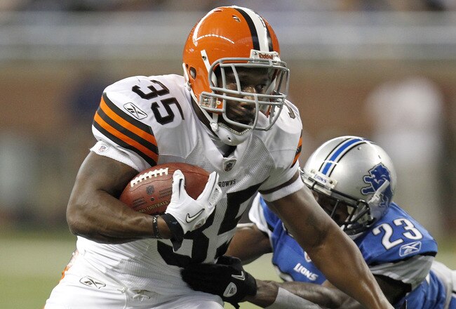 DETROIT - AUGUST 28:  Jerome Harrison #35 of the Cleveland Browns tries to escape the tackle of Chris Houston #23 of the Detroit Lions during preseason game on August 28, 2010 at Ford Field in Detroit, Michigan.  (Photo by Gregory Shamus/Getty Images)