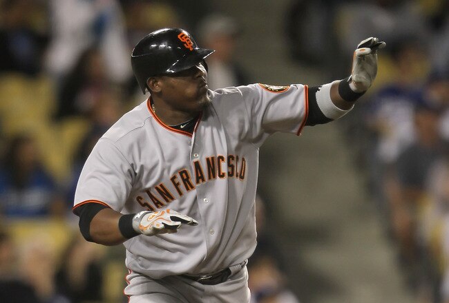 LOS ANGELES, CA - SEPTEMBER 04:  Juan Uribe #5 of the San Francisco Giants begins to run to first base after hitting a two-run home run against the Los Angeles Dodgers in the ninth inning at Dodger Stadium on September 4, 2010 in Los Angeles, California. The Giants defeated the Dodgers 5-4.  (Photo by Jeff Gross/Getty Images)