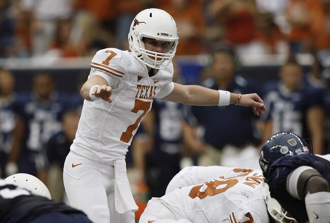 HOUSTON - SEPTEMBER 04:  Quarterback Garrett Gilbert #7 of the Texas Lonhgorns changes the pplay at the line of scrimmage during a football game agasint the Rice Owls at Reliant Stadium on September 4, 2010 in Houston, Texas. Texas beat Rice 34-17.  (Photo by Bob Levey/Getty Images)