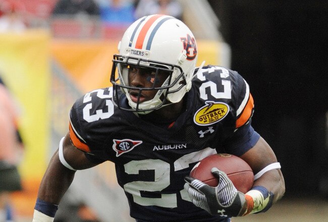 TAMPA, FL - JANUARY 1: Running back Onterio McCalebb #23 of the Auburn Tigers rushes upfield against the Northwestern Wildcats in the Outback Bowl January 1, 2010 at Raymond James Stadium in Tampa, Florida.  (Photo by Al Messerschmidt/Getty Images)