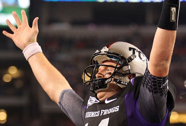 ARLINGTON, TX - SEPTEMBER 04:  Quarterback Andy Dalton #14 of the TCU Horned Frogs celebrates a touchdown run against the Oregon State Beavers in the third quarter at Cowboys Stadium on September 4, 2010 in Arlington, Texas.  (Photo by Ronald Martinez/Getty Images)