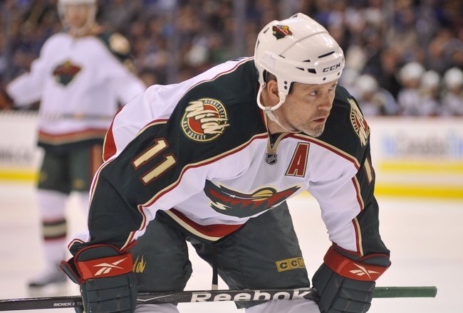 VANCOUVER, CANADA - APRIL 4: Owen Nolan #11 of the Minnesota Wild gets ready for a face-off during the NHL game against the Vancouver Canucks on April 04, 2010 at General Motors Place in Vancouver, British Columbia, Canada.  (Photo by Rich Lam/Getty Images)