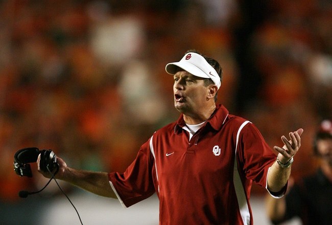 MIAMI GARDENS, FL - OCTOBER 03:  Head coach Bob Stoops of the Oklahoma Sooners protests a call by an official while taking on the Miami Hurricanes at Land Shark Stadium on October 3, 2009 in Miami Gardens, Florida. Miami defeated Oklahoma 21-20.  (Photo by Doug Benc/Getty Images)